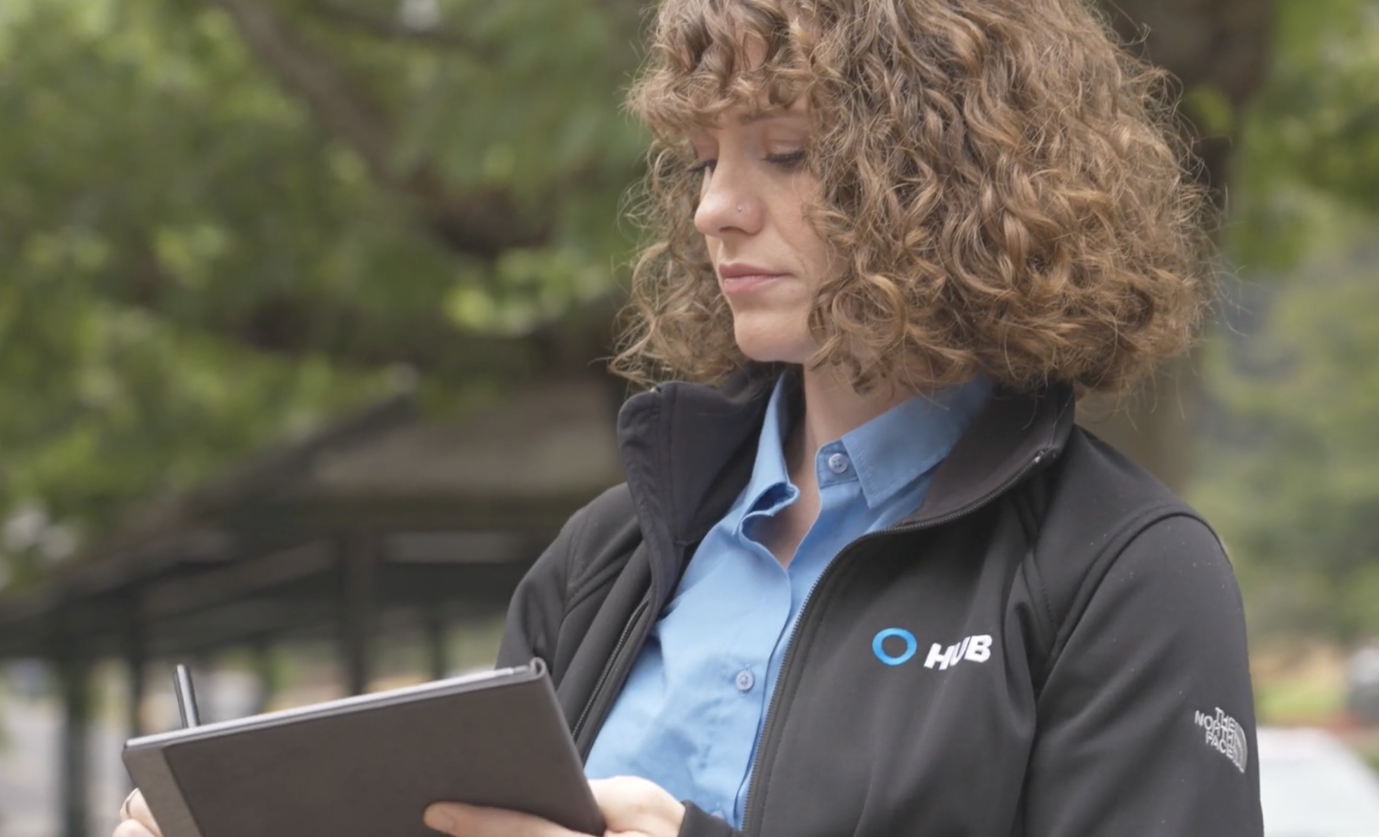 HUB Team Haugen advisor reviewing an account in the field